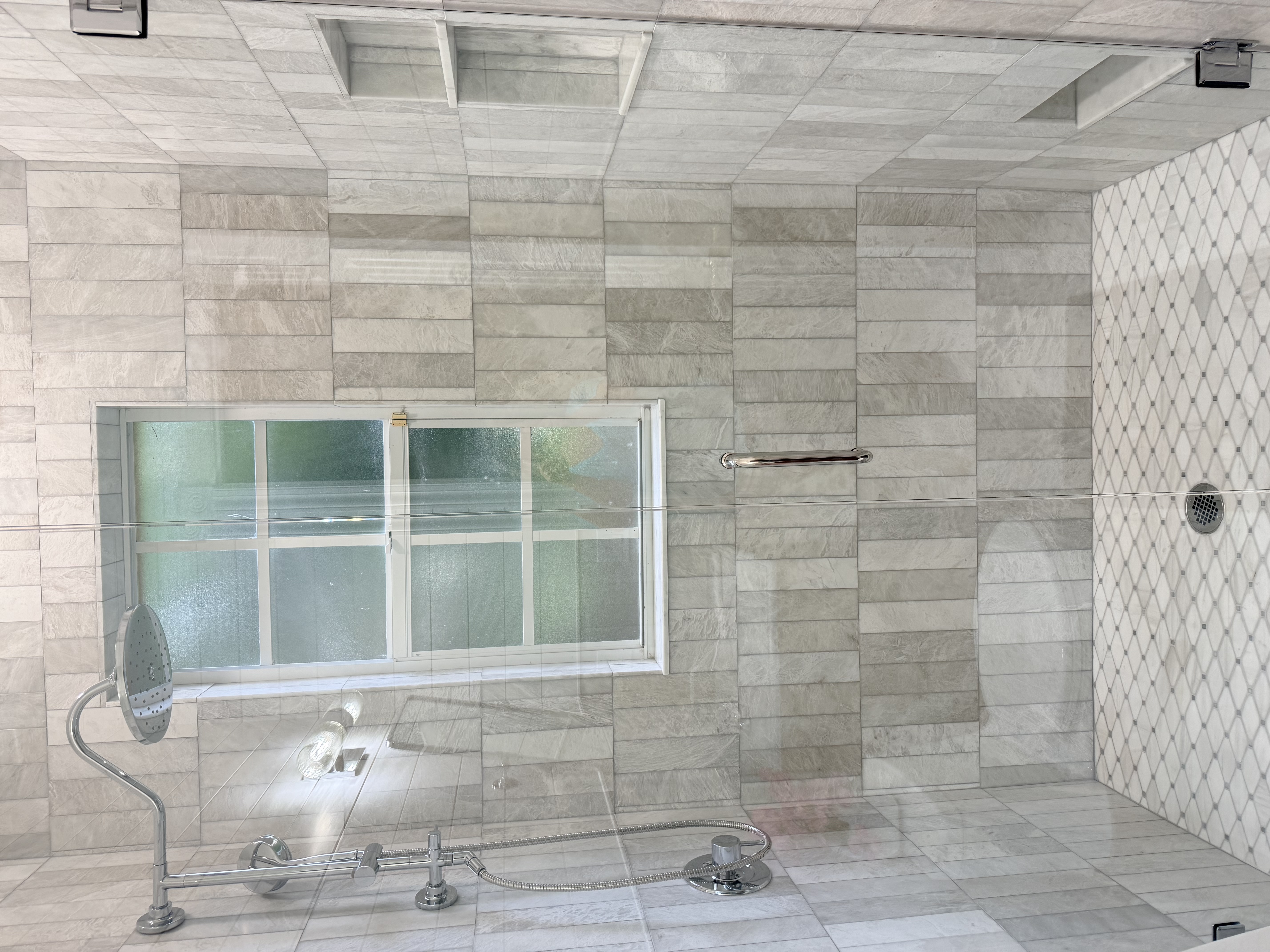 Walk-in shower with rain head and gray stone-plank tile, Largo FL